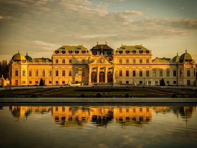 Upper Belvedere palace in Vienna, Baroque facade reflected in the formal pool at golden hour, home of Klimt The Kiss