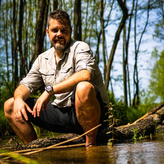 Nomaddreams sitting in a Forest River